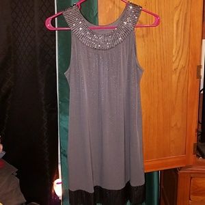 Shimmery gray dress with detail around the neck